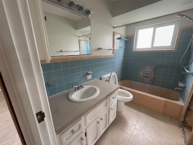 full bathroom with tile walls, toilet, vanity,  shower combination, and tile patterned flooring