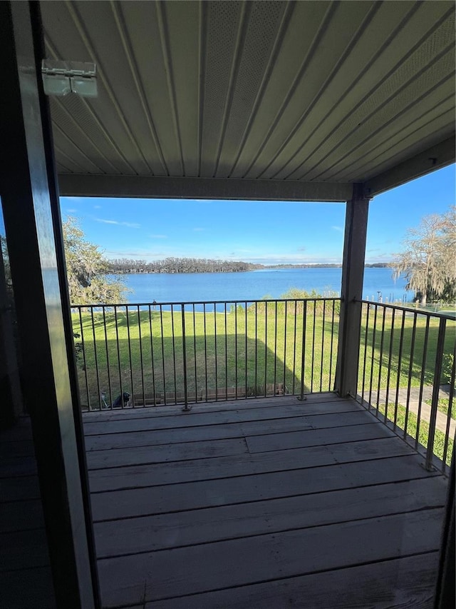 wooden terrace with a water view