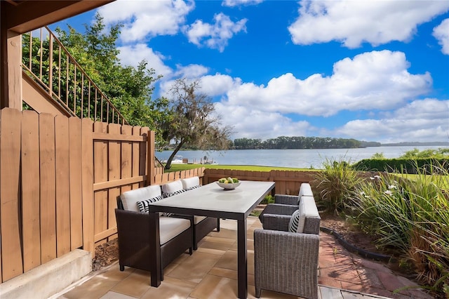 620 Georgetown Dr Unit 620, Casselberry, FL 32707 - view of patio / terrace with a water view, fence, and outdoor dining space