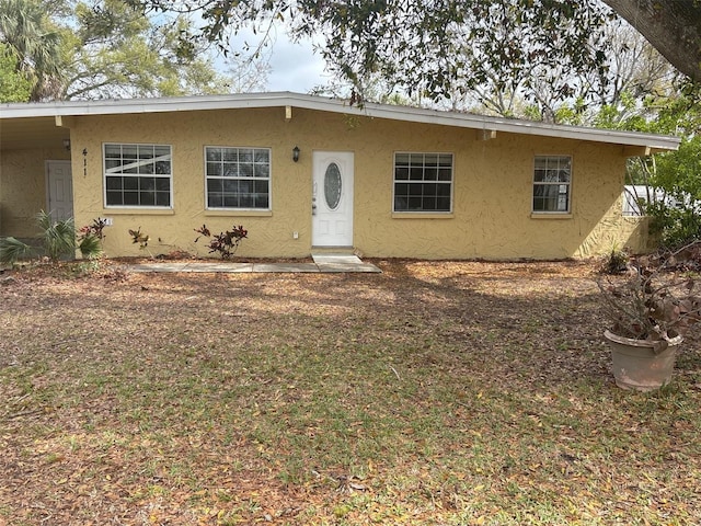 view of front of house featuring stucco siding