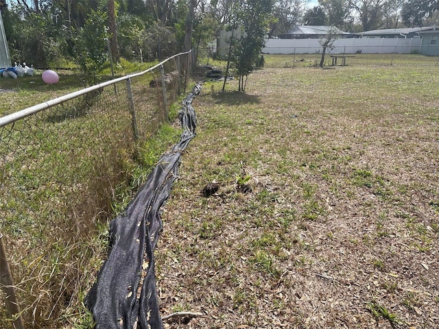 view of yard featuring fence