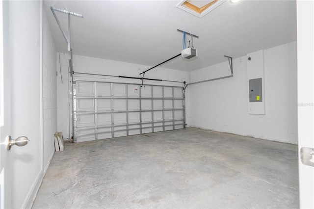 garage featuring electric panel and a garage door opener