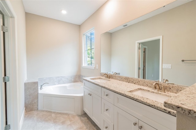 full bathroom with tile patterned floors, a garden tub, a sink, and double vanity