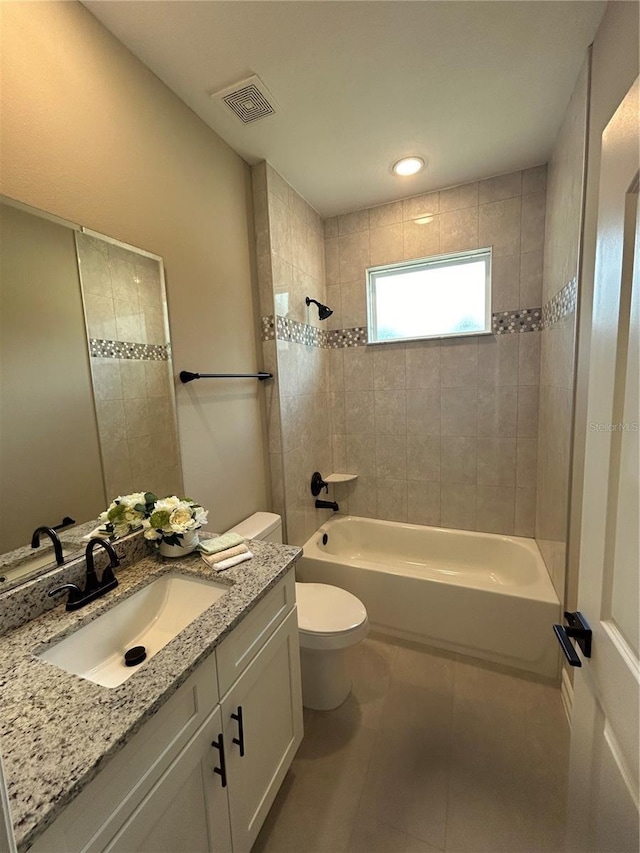 bathroom with visible vents, toilet, tile patterned flooring, bathtub / shower combination, and vanity