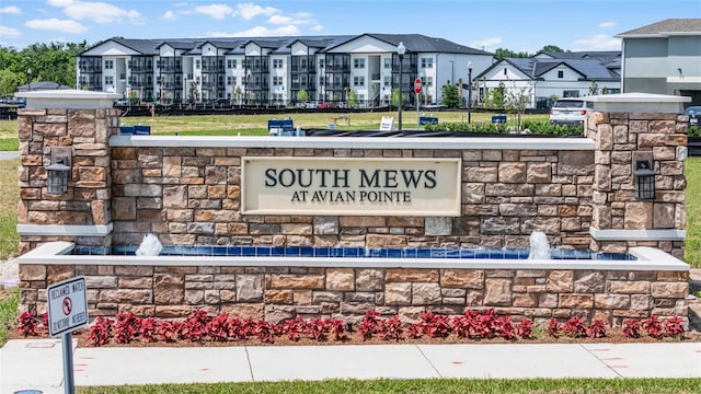 community / neighborhood sign featuring a residential view