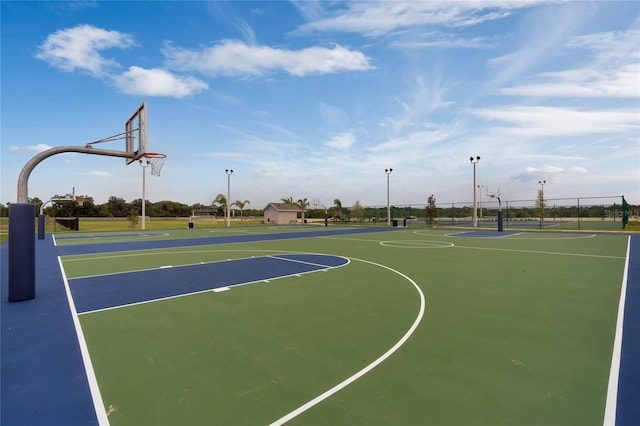 view of sport court featuring community basketball court and fence