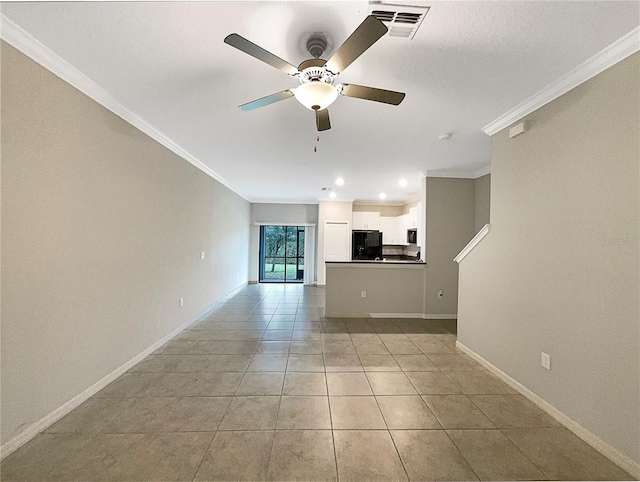 unfurnished living room featuring baseboards, visible vents, ornamental molding, and light tile patterned flooring