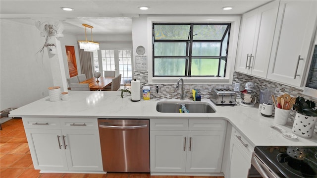 kitchen featuring light stone counters, a sink, white cabinetry, decorative backsplash, and dishwasher