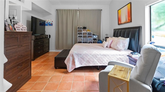 bedroom with light tile patterned floors