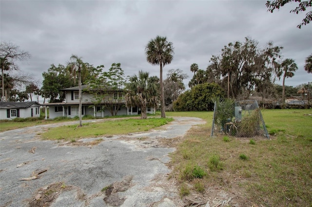 exterior space with driveway and a gated entry