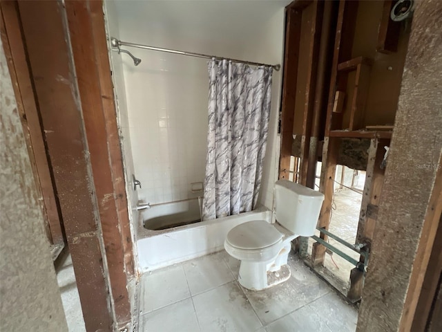 bathroom featuring toilet, tile patterned flooring, and shower / bathtub combination with curtain