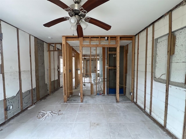 interior space with ceiling fan