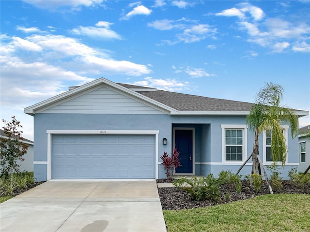 single story home with a garage, roof with shingles, driveway, and stucco siding