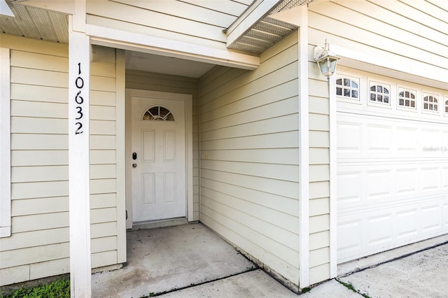 entrance to property featuring a garage