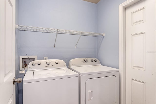 clothes washing area with laundry area and washing machine and clothes dryer