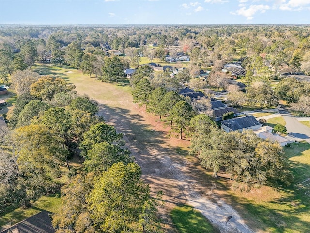 aerial view featuring a wooded view