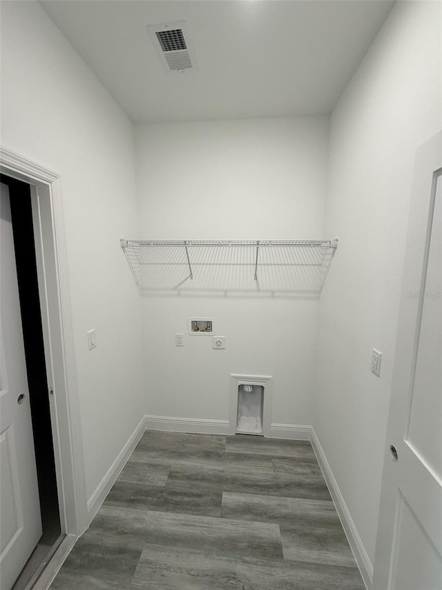 washroom with laundry area, washer hookup, wood finished floors, visible vents, and baseboards