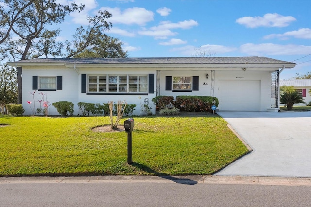 ranch-style house with a front yard, driveway, and an attached garage