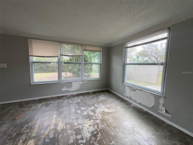 4435 Huntington St NE, Saint Petersburg, FL 33703 - spare room featuring baseboards and a textured ceiling