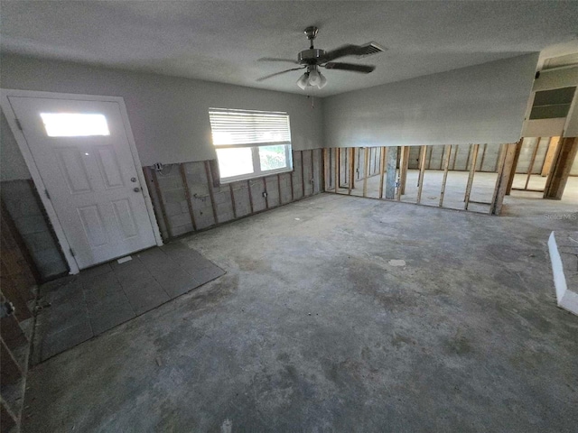 entrance foyer featuring concrete flooring and visible vents