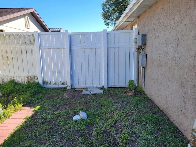 view of gate featuring fence