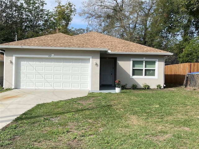 ranch-style home with stucco siding, a shingled roof, an attached garage, a front yard, and fence