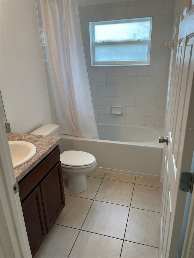 bathroom with toilet, shower / tub combo, vanity, and tile patterned floors