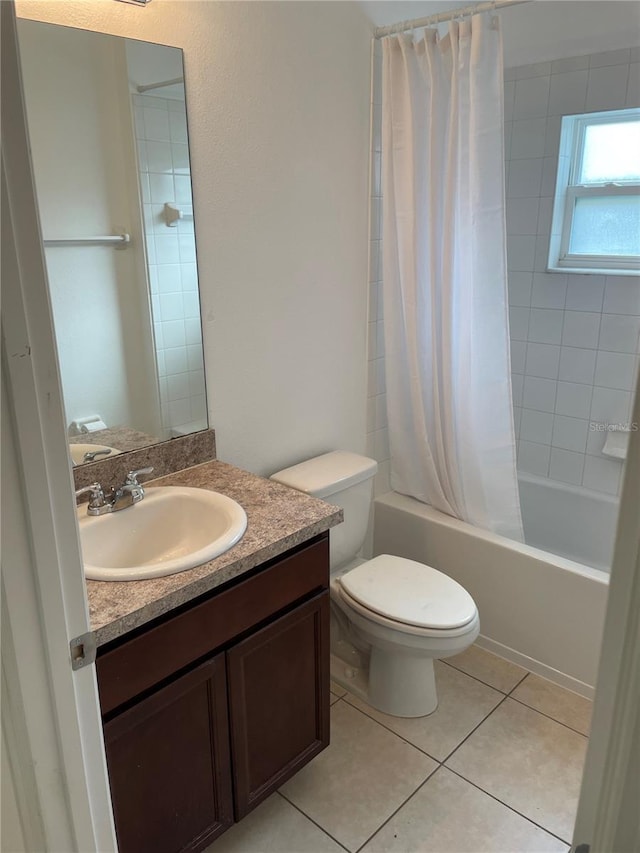 full bathroom with toilet, vanity, tile patterned flooring, and shower / bath combo with shower curtain