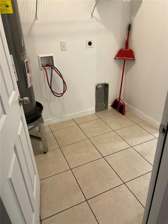 clothes washing area featuring light tile patterned floors, laundry area, washer hookup, and hookup for an electric dryer