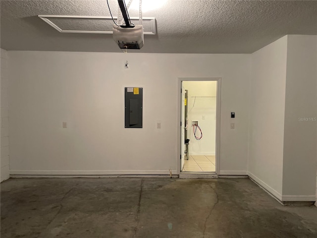 garage featuring baseboards, electric panel, and a garage door opener