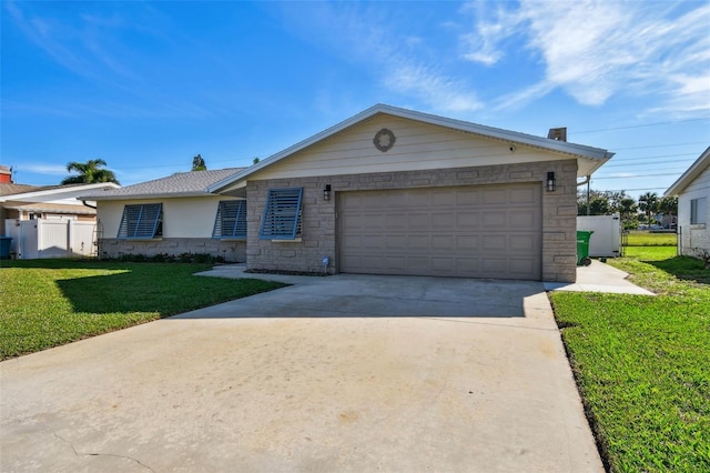 ranch-style house featuring a front yard, fence, driveway, a garage, and stone siding