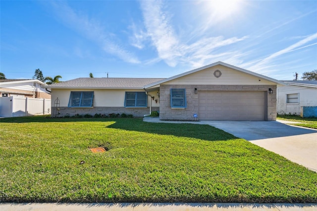 ranch-style home with fence, concrete driveway, a front yard, a garage, and stone siding