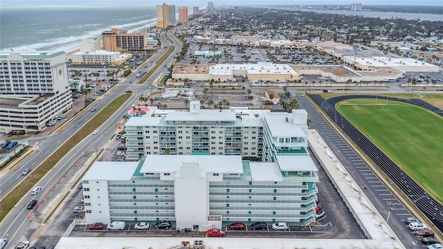 birds eye view of property featuring a city view and a water view