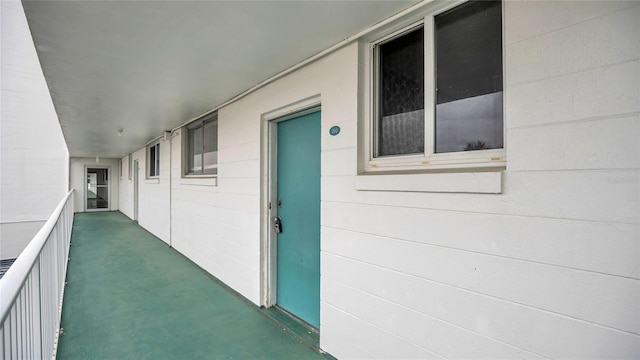 entrance to property with concrete block siding