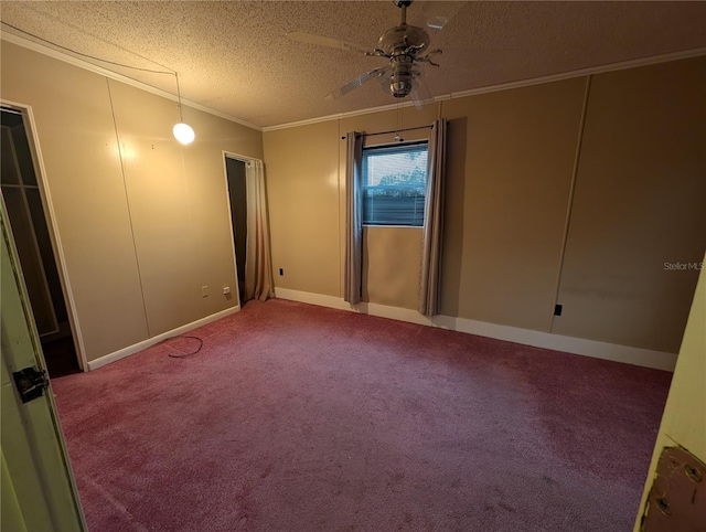 unfurnished bedroom with a ceiling fan, carpet, vaulted ceiling, a textured ceiling, and crown molding