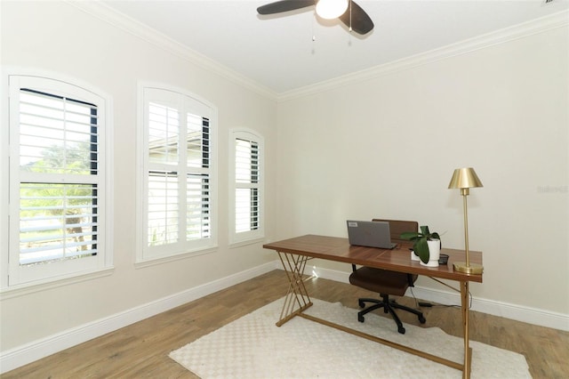 office space featuring ornamental molding, wood finished floors, a ceiling fan, and baseboards