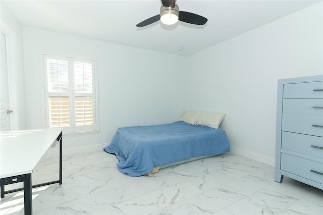 bedroom with marble finish floor, baseboards, and a ceiling fan