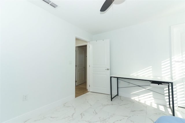 unfurnished bedroom with marble finish floor, visible vents, baseboards, and ceiling fan