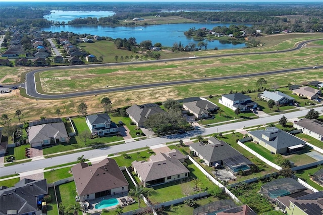 bird's eye view with a residential view and a water view