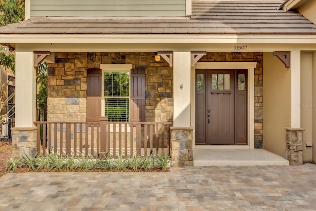 entrance to property with stone siding