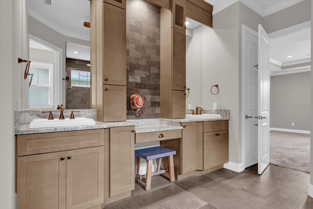 full bathroom featuring ornamental molding, two vanities, and a sink