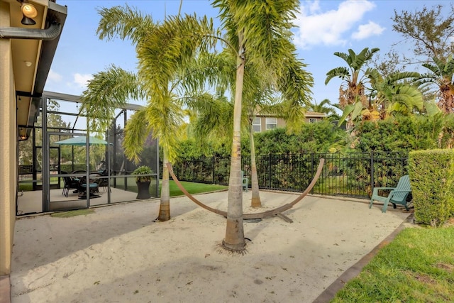 view of jungle gym with a patio area and fence