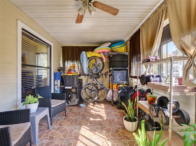 interior space featuring a ceiling fan