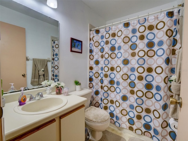 full bathroom with toilet, curtained shower, and vanity