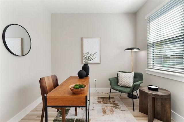 office space featuring light wood finished floors and baseboards