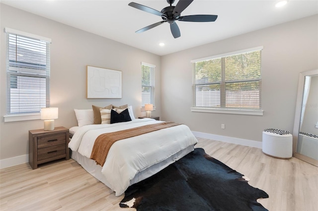 bedroom featuring light wood-style floors, baseboards, a ceiling fan, and recessed lighting