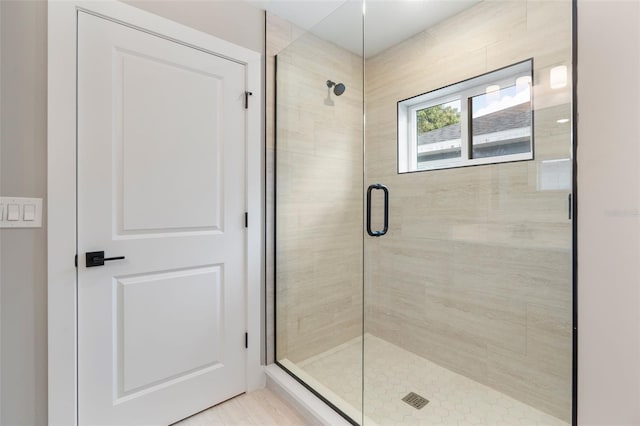 full bath with a shower stall