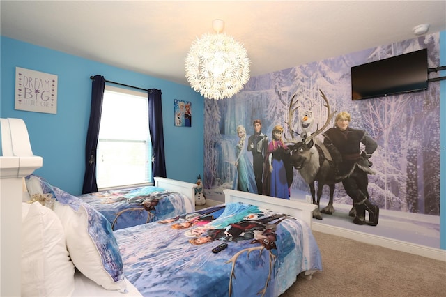 carpeted bedroom featuring a notable chandelier and baseboards