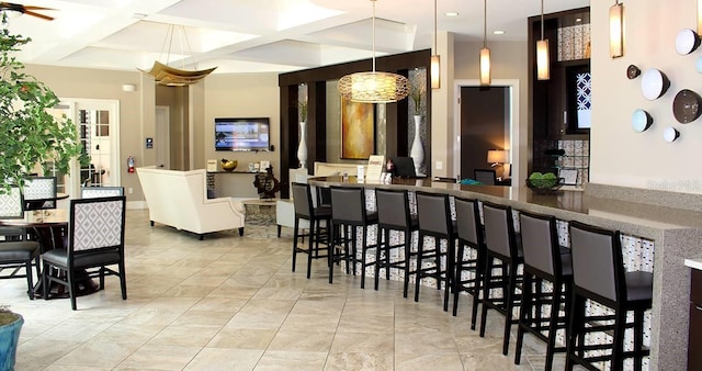 interior space with recessed lighting, pendant lighting, coffered ceiling, and beam ceiling