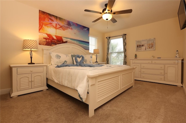 carpeted bedroom with a ceiling fan